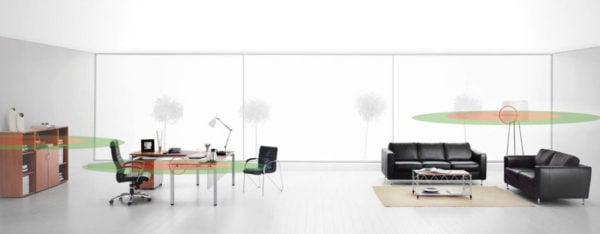 In-building corporate monitoring office with table, desk, chairs, and couches